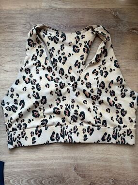 Fabletics Leopard Print V-Neck Sports Bra in Cream and Black